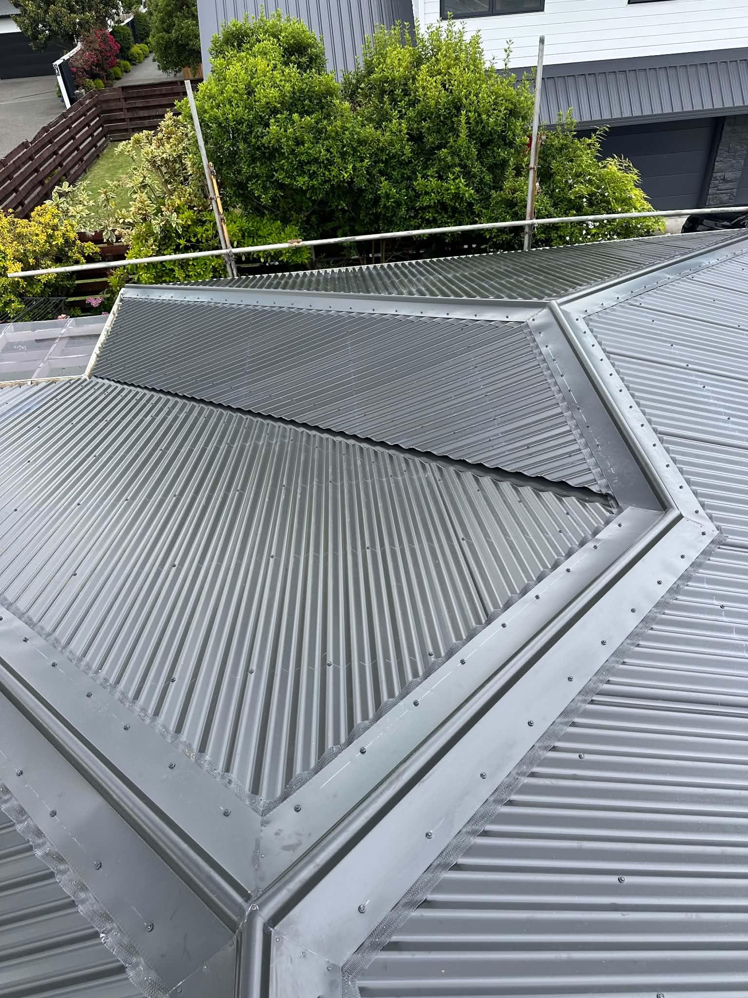 Side view of a completed roofing project by Essential Roofing in Tauranga
